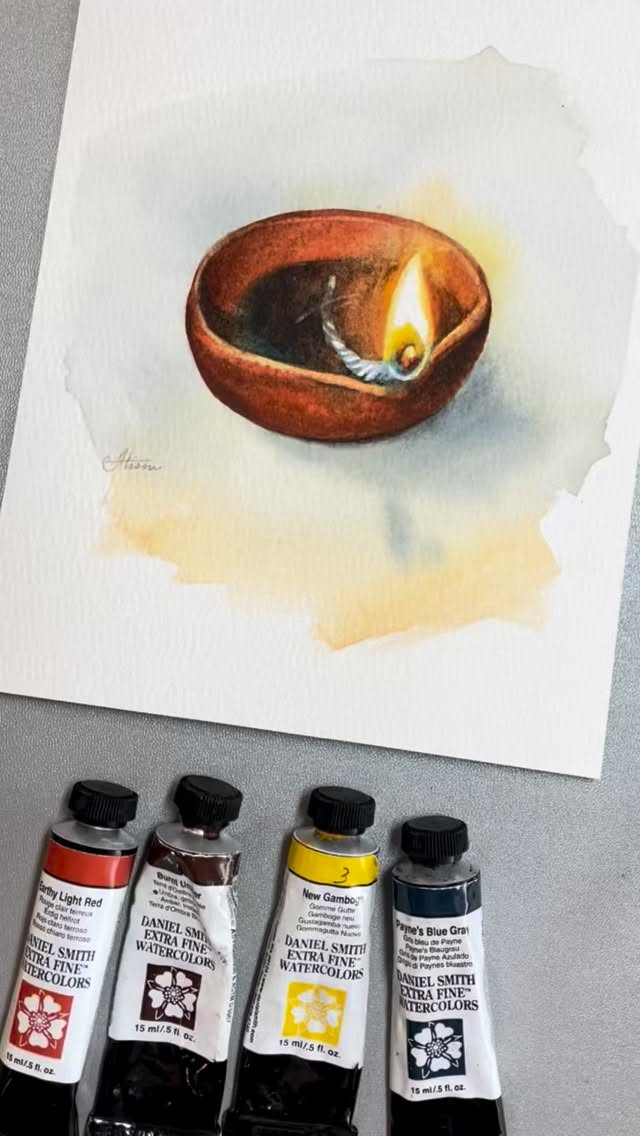 It’s Friday Fun Takeover by Brand Ambassador Alison Pinto @alisonpintoartEarthen Light Colors used: Earthy Light Red, New Gamboge, Burnt Umber, Cobalt Blue, Paynes Blue Grey Such a simple thing, a hand-shaped clay bowl, a cotton wick and a little oil! But I love these little earthen lights. During the festival of lights in India this week, there’s just something so magical to see many of these lined up with their flames flickering. And what better to paint an earthen pot than Earthy Light Red! What a color... it makes painting earthen subjects a breeze! I hope you enjoy this!Friday Fun is about just doing a little sketch, having fun with it. The mindfulness of a little doodling session quiets the mind, while the fact that its “just a quick sketch” sets you free from the pressure of results and lets you simply enjoy the process! The exercise might amount to nothing other than relax you, but the fun of playing might just surprise you!!”- Alison Pinto Key to Alison’s process “…I wet the surface with clear water, sometimes randomly, and drop in juicy paint and enjoy watching it burst across the dampened surface. I love working wet-into-wet because that’s when you see the pigments play best.” - Alison Pinto Try it and share your experience with us, # hashtag us :)#danielsmith  #danielsmithartistmaterials #danielsmithwatercolors #watercolor